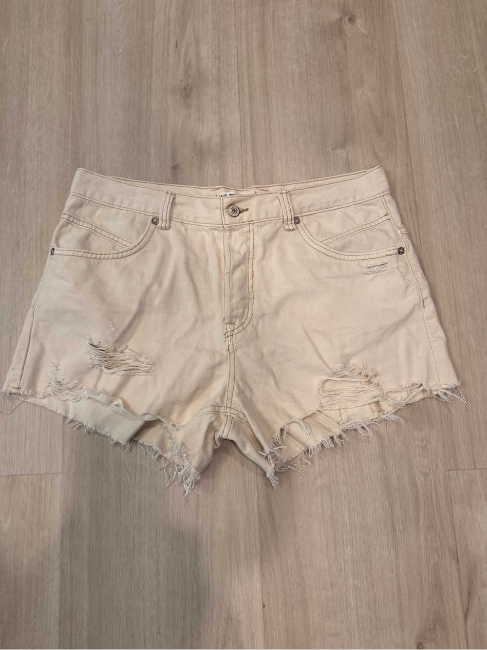 We the Free - Women's Distressed Cream Denim Shorts. Size 29